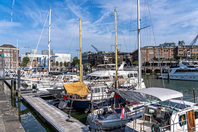 Rotterdam Marina, behind high-rise buildings in the Maritiem District on the other side of the Nieuwe Maas, bascule bridge, pleasure craft harbour, sailing boats, motor yachts, in the inland harbour, Feijenoord district, Rotterdam, Netherlands