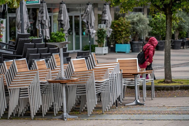 Stacked chairs and tables from various catering establishments, on Kennedyplatz, closed cafes, pubs, restaurants, effects of the lockdown in the corona crisis in Essen, North Rhine-Westphalia, Germany, Europe