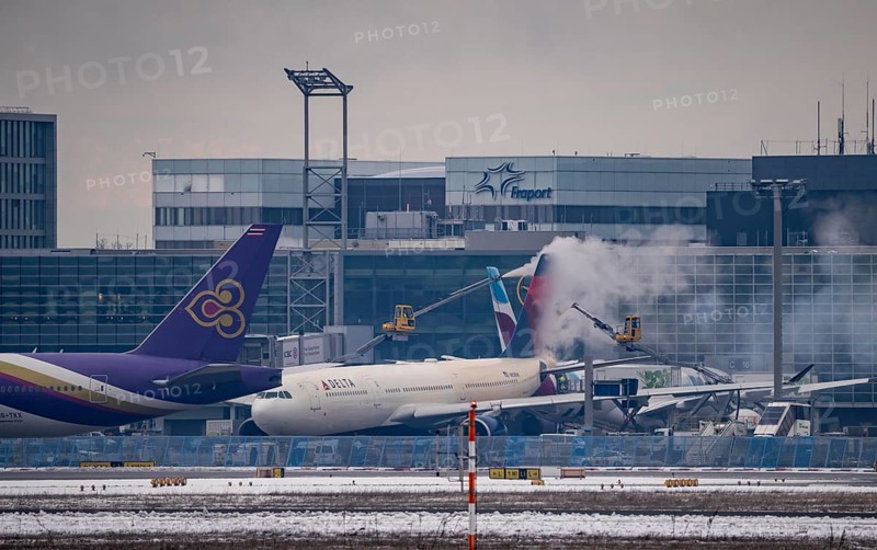 Winter at Frankfurt Main Airport, FRA, Delta aircraft being de-iced at the terminal, Hesse, Germany, Europe