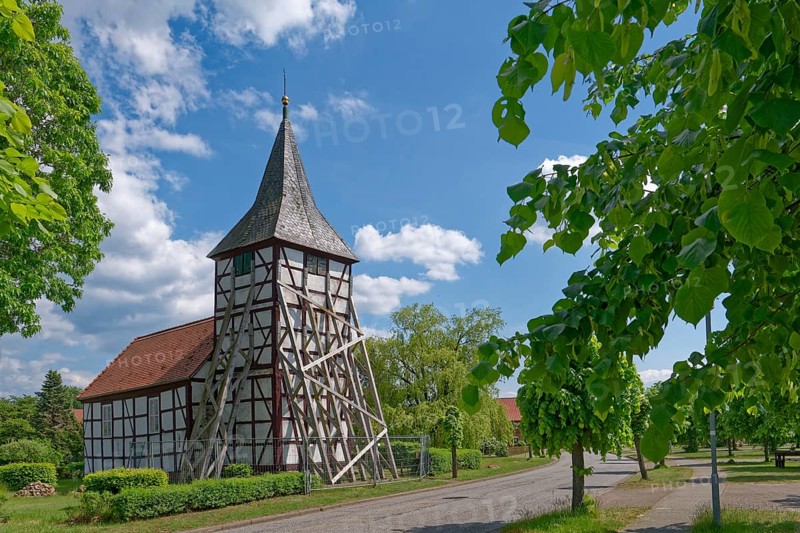 Half-timbered church in Wenze, stabilised against collapse with squared timbers, in the UNESCO Drömling Biosphere Reserve. Hanseatic town of Salzwedel in the Altmark, Saxony-Anhalt, Germany, Europe