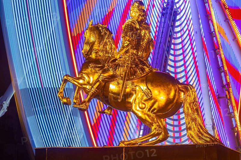 Augustus Market in Dresden. Equestrian statue of Augustus the Strong, also known as the Golden Horseman, with a Ferris wheel turning behind it, Dresden, Saxony, Germany, Europe