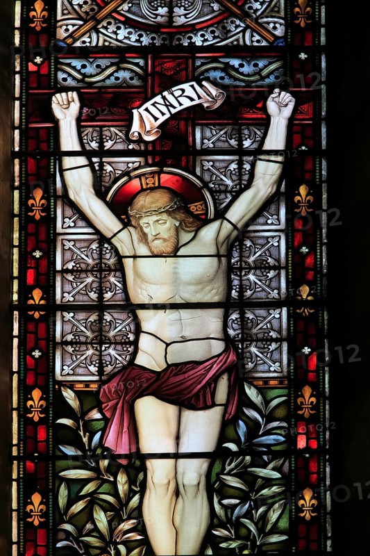 Stained glass Jesus Christ on cross church of Saint Mary Magdalene, Debenham, Suffolk, England, UK