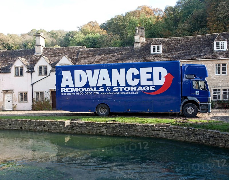 Removal van in Castle Combe, Wiltshire, England, UK claimed to be England's prettiest village
