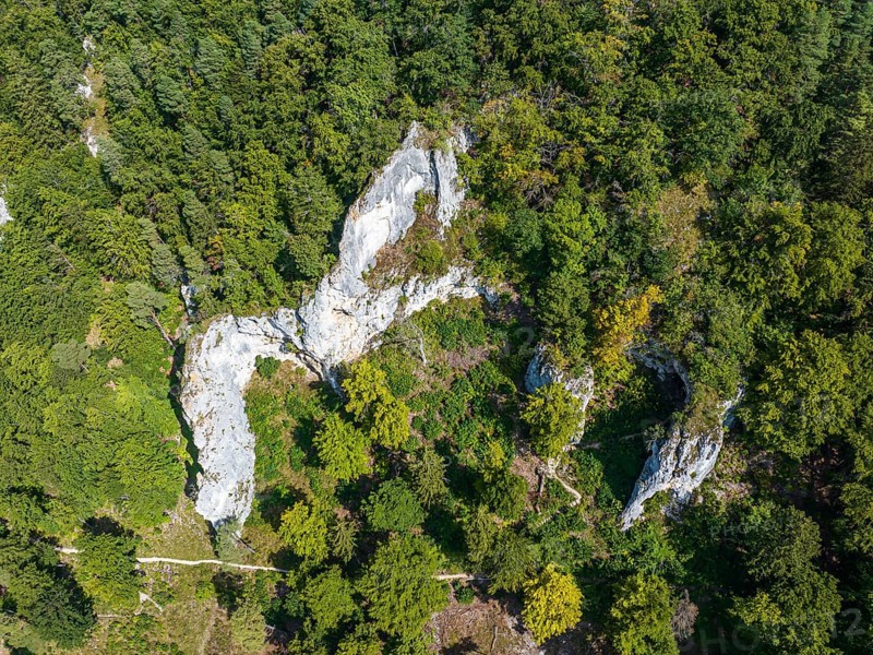 UNESCO World Heritage Caves and Ice Age Art of the Swabian Alb. Ice Age cave Geißenklösterle in the Achtal valley, site of important archaeological excavations from the Aurignacian period, drone photo. Blaubeuren, Baden-Württemberg, Germany, Europe