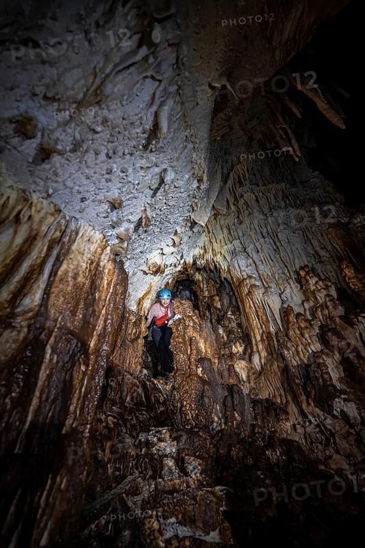 Woman exploring stalactite cave, Terciopelo Cave, Barra Honda National Park, Costa Rica, Central America
