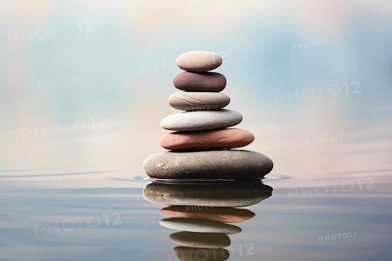 Stack of zen stones on water with a nature background. The image conveys a sense of balance, harmony, and peace. Suitable for use in wellness, therapy, and relaxation concepts, AI generated