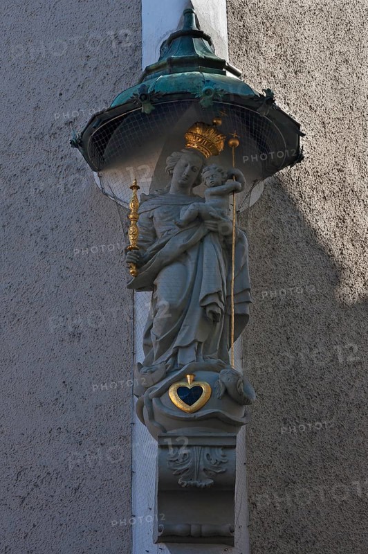 Sculpture of St Mary with the infant Jesus under a canopy on the corner of a house, Regensburg, Upper Palatinate, Bavaria, Germany, Europe
