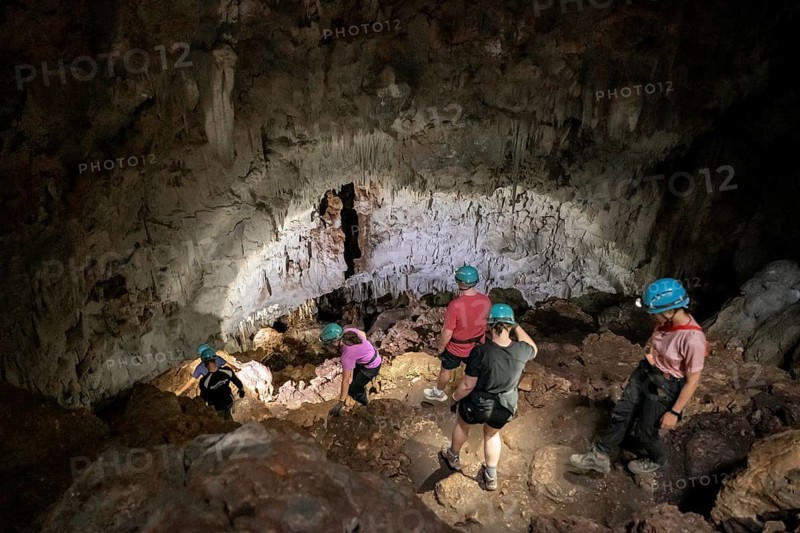 Visitors in a stalactite cave, Terciopelo Cave, Barra Honda National Park, Costa Rica, Central America