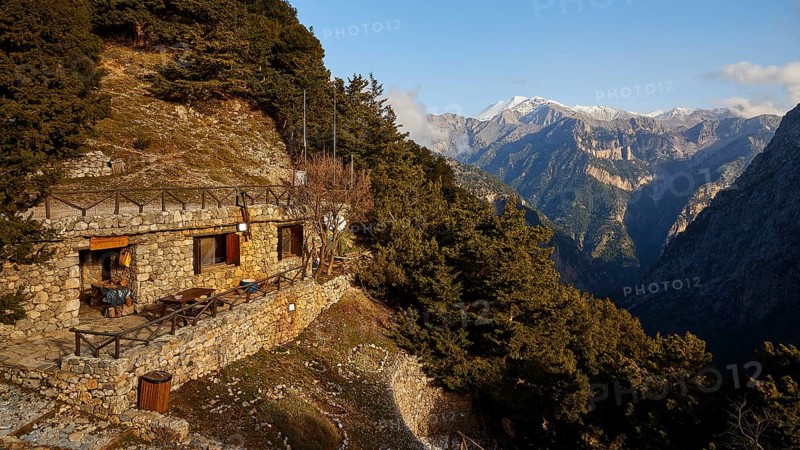 A lonely stone house on a mountain with breathtaking views of the forested mountains, entrance to the Samaria Gorge, Omalos Plateau, Lefka Ori, White Mountains, mountain massif, west, Crete, Greece, Europe