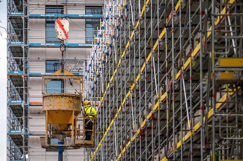 Concreting work on a construction site, new construction of a high-rise office building, facade of the shell, scaffolding, Cologne, North Rhine-Westphalia, Germany, Europe
