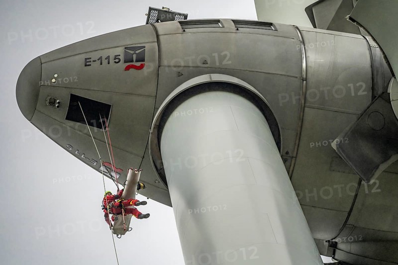 Height rescuers from the Oberhausen professional fire brigade practise abseiling from a wind turbine from a height of 150 metres, rescuing an injured person, technician, from the nacelle, Issum, North Rhine-Westphalia, Germany, Europe