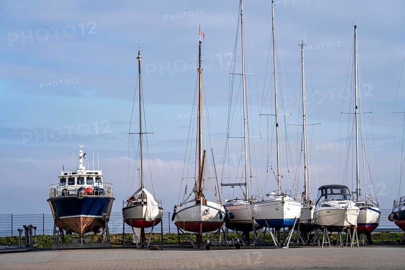Boats, sailing boats laid up, wintering in the harbour of Norddeich, Lower Saxony, Germany, Europe