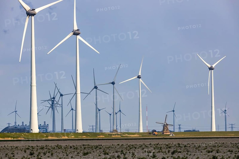 Westereems and Growind wind farms, over 80 wind turbines in total, at the Eemshaven seaport, province of Groningen, in the north-west of the Netherlands, historic Goliath windmill from 1897