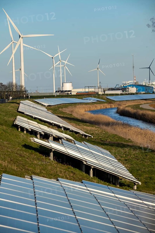 Solar park on the Slaperdijk dyke near the Eemshaven, test project, 17, 000 solar modules were installed over a good 5 kilometres, the Netherlands has over 22, 000 kilometres of dyke line, here it is being tested whether such an installation is successful and can be expanded, wind farm, Groningen, Netherlands