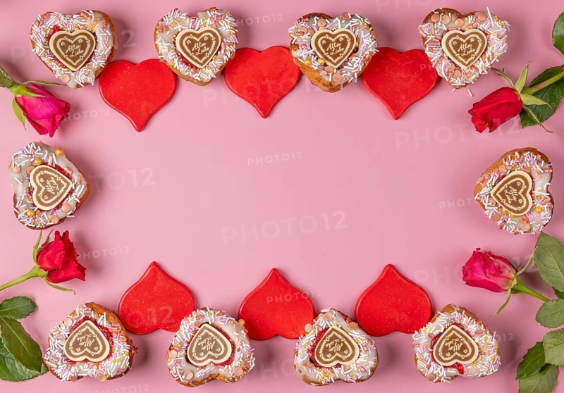 Frame made of heart-shaped cupcakes, red hearts and roses, Valentine's Day, pink background
