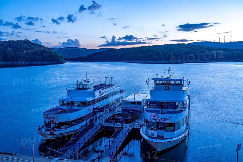Lake Rursee, reservoir in the Eifel National Park, north-east bank near Heimbach, at the Rur dam Schwammenauel, excursion boats of the Rursee-Schifffahrt at the jetty, North Rhine-Westphalia, Germany, Europe