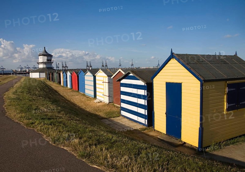 Colourful seaside beach huts and Low lighthouse maritime museum, Harwich, Essex, England, United Kingdom, Europe