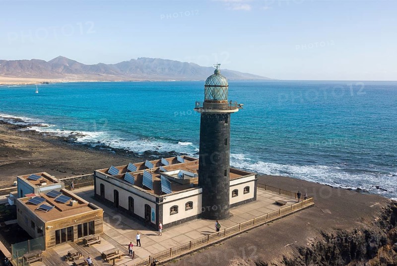 Aerial view of lighthouse Faro Punta de Jandia on southern tip of Jandia peninsula, on flat roof solar panels for alternative power generation energy production by solar energy, Fuerteventura, Canary Islands, Canary Islands, Spain, Europe
