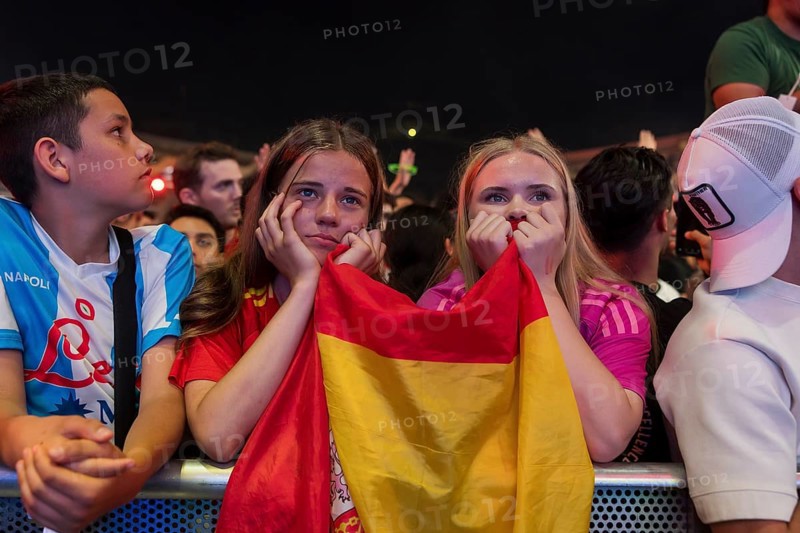 Two female fans of the Spanish team fear after the English equaliser at the Adidas fan zone at the Bundestag during the final match between Spain and England at the European Football Championship, Berlin, 14.07.2024