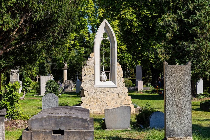 A new monument can be seen at Caspar David Friedrich's grave in Dresden's Trinitatisfriedhof cemetery to mark the 250th birthday of the most famous Romantic artist. The Gothic church window made of sandstone with an owl in rear view on the ledge. The construction was supported by the actor and Friedrich admirer Tom Pauls, Grave of Caspar David Friedrich, Dresden, Saxony, Germany, Europe