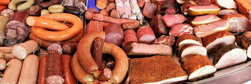 Panoramic picture of a sausage counter in a butcher's shop