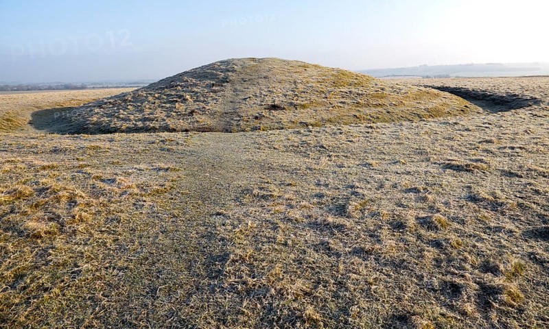 Bronze Age bowl barrow on Windmill Hill, a Neolithic causewayed enclosure, near Avebury, Wiltshire, England, UK