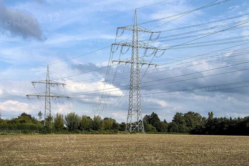 Two overhead line pylons High-voltage pylons Power pylons Support electricity pylon Suspension of electrical overhead line Overhead line for transmission of electrical energy Electricity Power supply Power supply, Germany, Europe