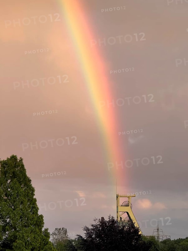 Rainbow stands exactly above former winding tower of closed colliery for coal mining Symbol for the decline of mining, North Rhine-Westphalia, Germany, Europe