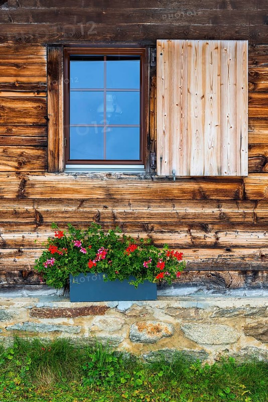 Lovingly decorated mountain hut, wooden hut, alpine hut, picturesque, flowers, window, house wall, tourism, travel, Riederalp, Valais, Switzerland, Europe