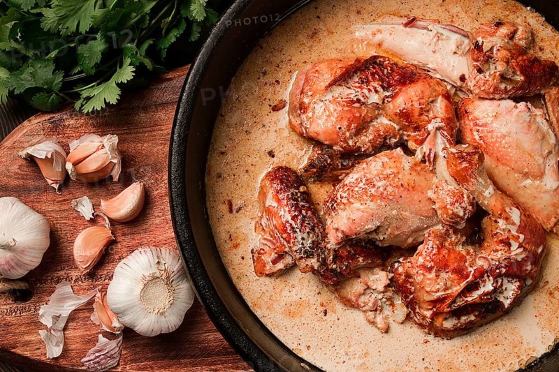 Shkmeruli, fried chicken, in milk-garlic sauce, Georgian cuisine, homemade, close-up, no people