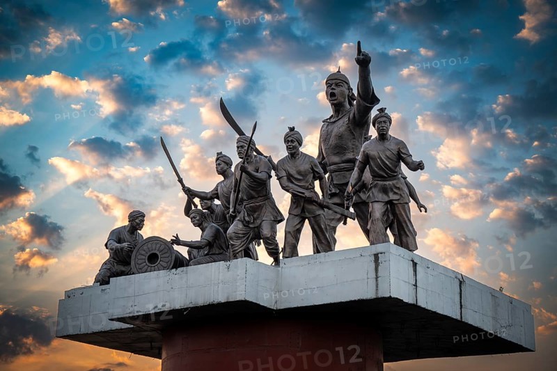 Guwahati, India. 25 November 2024. Statue of Ahom commander Lachit Barphukan and soldiers stands in the Brahmaputra river, made by master sculptor Biren Singha in 2016, in Guwahati