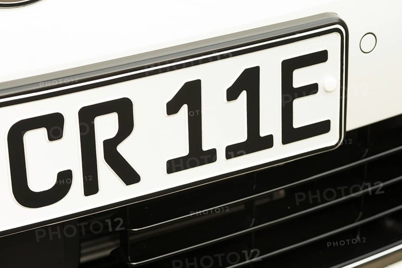 Black and white vehicle registration plate, licence plate, registration number of an electric car (E-Golf) with the combination CR 11E, new car, Lower Saxony, Germany, Europe