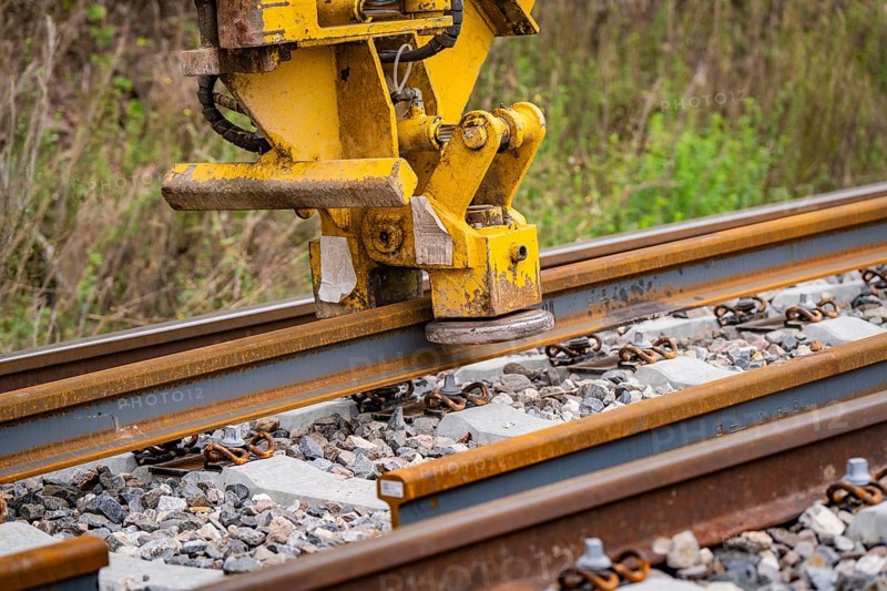 Close-up of a yellow construction machine working on a rail, track construction, Hermann Hessebahn, Calw, Black Forest, Germany, Europe