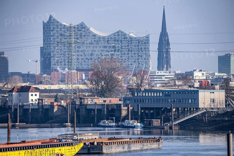 Hamburg harbour, Travehafen, water police station 2, working boats and barges, jetty, city skyline in the background, Elbe Philharmonic Hall concert hall, tower of the St. Nikolai memorial, Hamburg, Germany, Europe