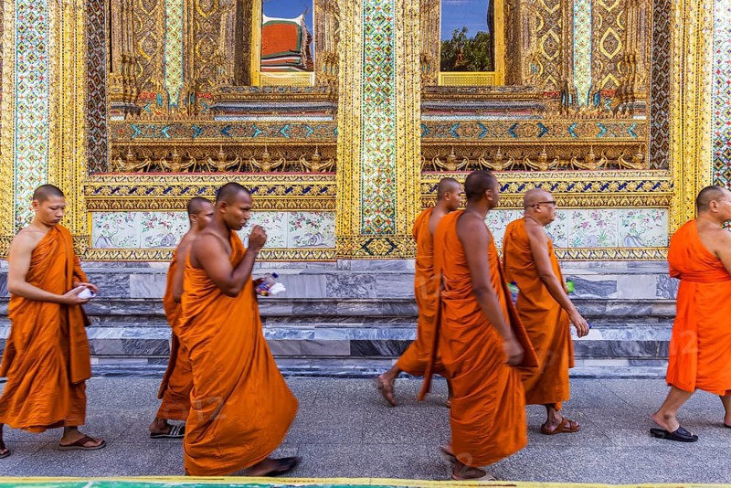 Wat Phra Kaeo temple, royal palace. Royal chapel with Buddhist monks and novices. Bangkok, Thailand, Asia
