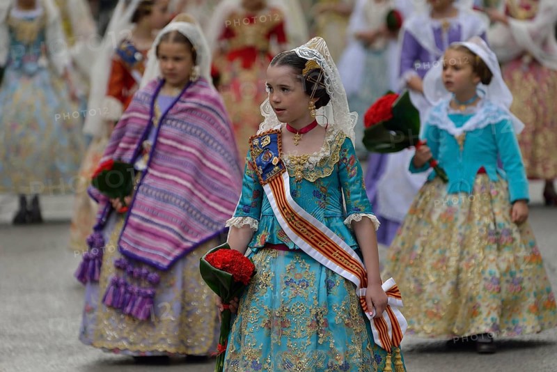 Fallas festival, girls in a traditional costume during the parade in the Plaza de la Virgen de los Desamparados, Valencia, Spain, Europe