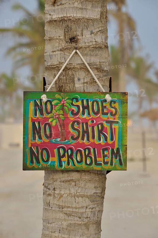 Sign "No shoes, no shirt, no problem" on the beach of Salalah Rotana Resort, Salalah, Dhofar Region, Oman, Asia
