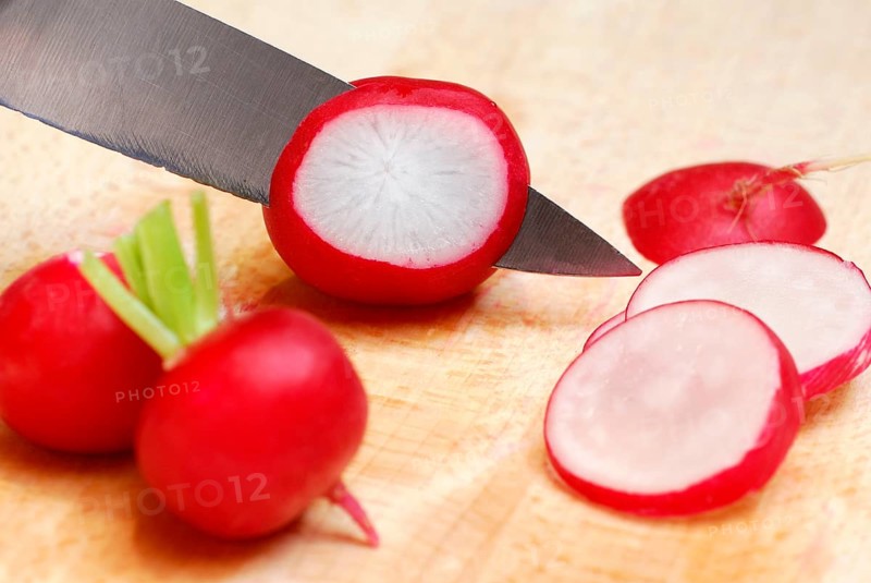 Red Radish (Raphanus sativus var. sativus) are cut, cut, knife