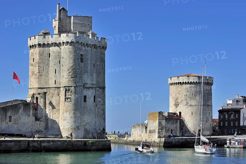 The medieval towers Tour de la Chaine and Tour Saint-Nicolas in the old port, Vieux-Port in La Rochelle, Charente-Maritime, France, Europe