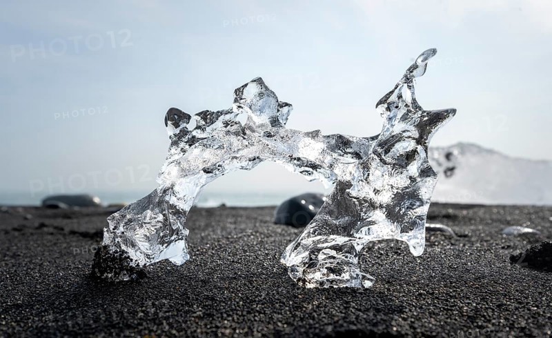 Ice, piece of ice on black sand beach, on black lava beach Diamond Beach, Southeast Iceland, Iceland, Europe