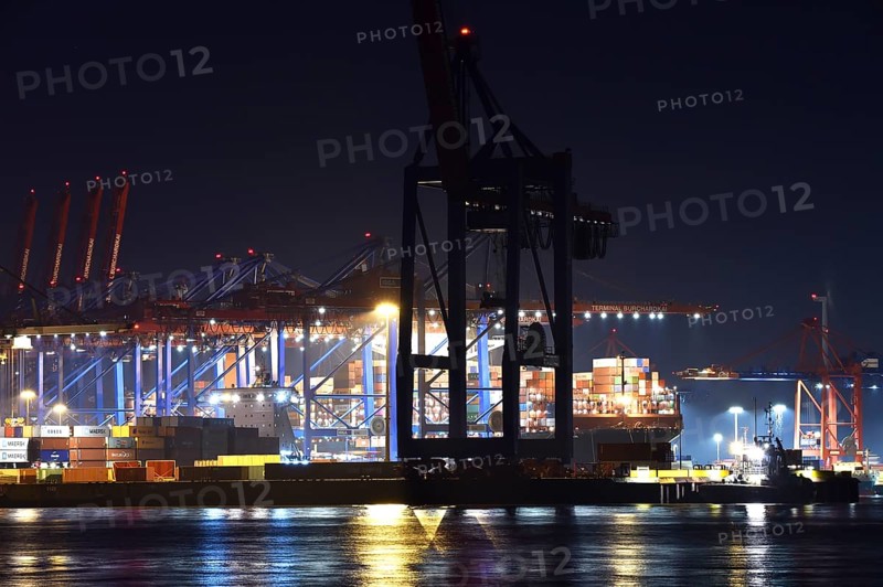 Container ships being loaded at night at the container terminal Burchardkai, Hamburg, Germany, Europe
