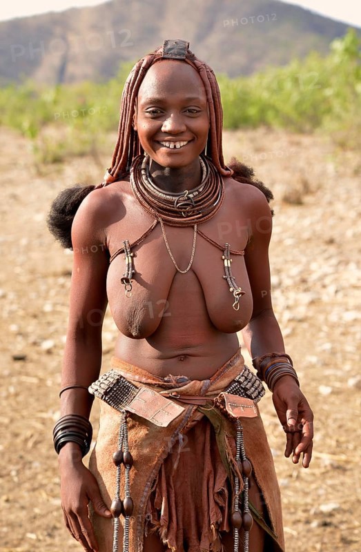 Young Himba woman with traditional jewellery, Ombombo, Kaokoland, Kunene, Namibia, Africa