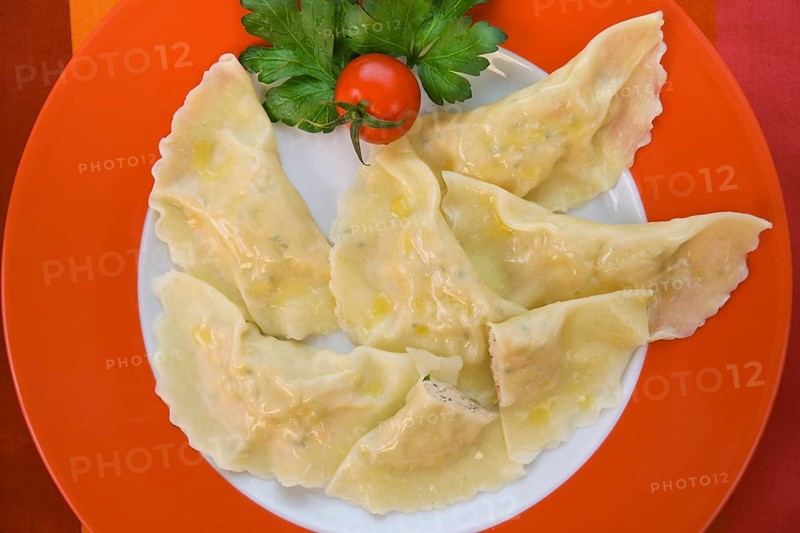 Swabian cuisine, salmon ravioli, fish dish, salmon in pasta dough, Swabian ravioli, served on a plate, typical Swabian, traditional cuisine reinterpreted, food photography, studio, Germany, Europe