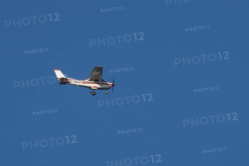 Cessna F182Q Skylane aircraft flying in a blue sky, England, United Kingdom, Europe