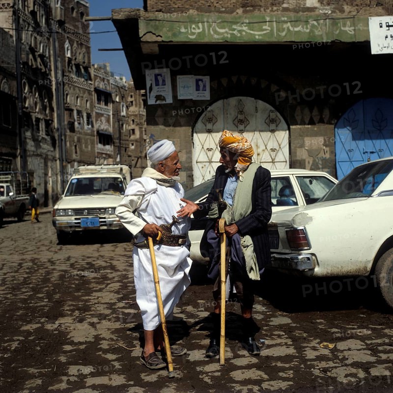 Two men talking in the old town of Sanaa, UNESCO World Heritage Site, Sanaa, Yemen, Asia