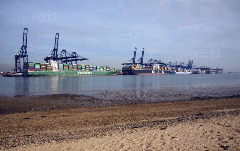 Container ships and cranes in the Port of Felistowe, Britain's busiest container port, pictured from across the River Orwell at Shotley, Sufolk, England, United Kingdom, Europe