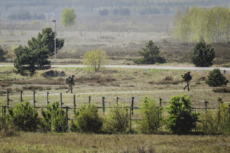 Two armed soldiers, photographed as part of a Bundeswehr exercise with forces from Norway and the Czech Republic during the 'Wettiner Schwert' exercise as part of Quadriga 2024 in the training town of Schnöggersburg, 8 April 2024