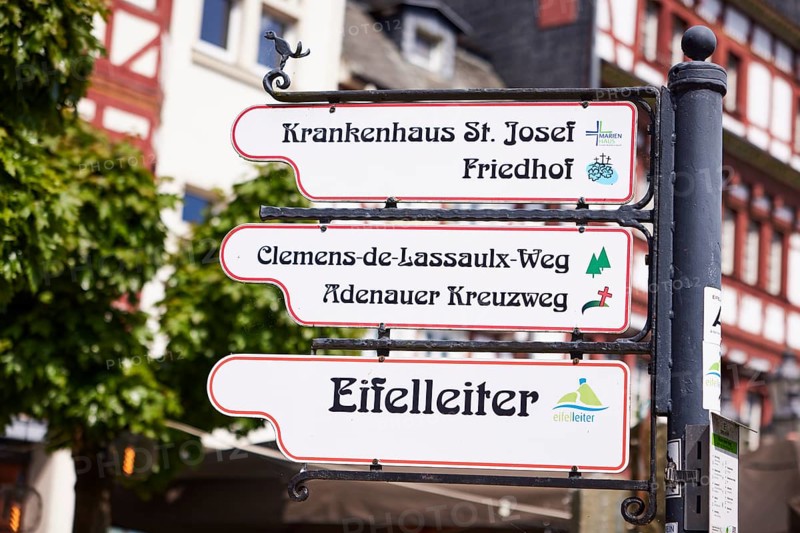 Signposts to St. Josef Hospital, cemetery, Clemens-de-Lassauix-Weg, Adenauer Kreuzweg and Eifelleiter in Adenau, Eifel, district of Ahrweiler, Rhineland-Palatinate, Germany, Europe