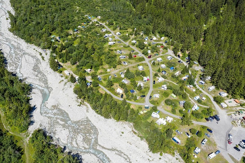 Drone shot, Camp site in La Fouly, camping site is located on a glacier moraine near a glacier river, Switzerland, Europe