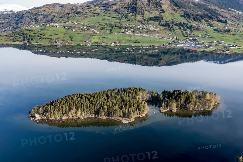 Island with small holiday cottage, lake Hafslovatnet east of town Sogndal, reflections in the lake, Norway, Europe